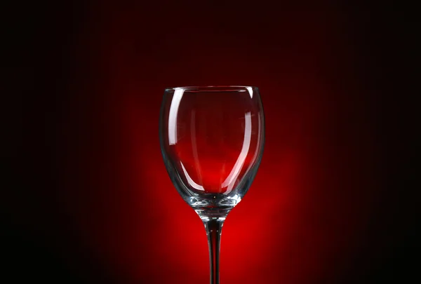 Empty wineglass on dark red background — Stock Photo, Image