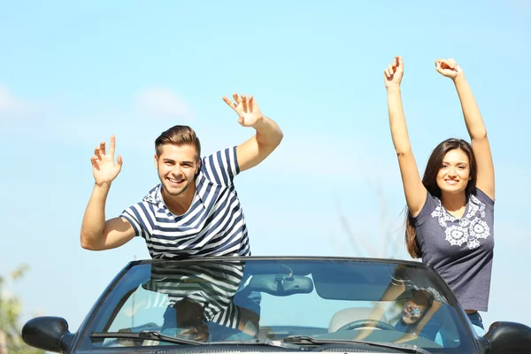 Couple in cabriolet car — Stock Photo, Image