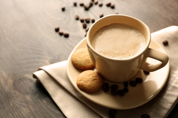 Cup of coffee on wooden table background — Stock Photo, Image