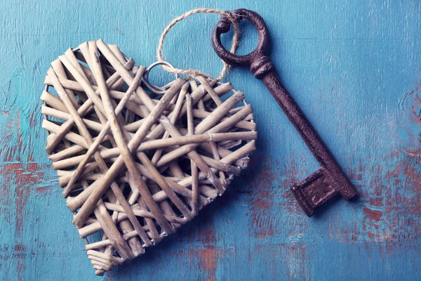 Old key with decorative heart — Stock Photo, Image