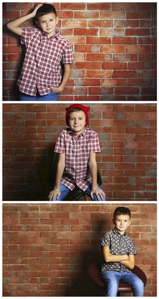 Lindo niño en la pared de ladrillo — Foto de Stock