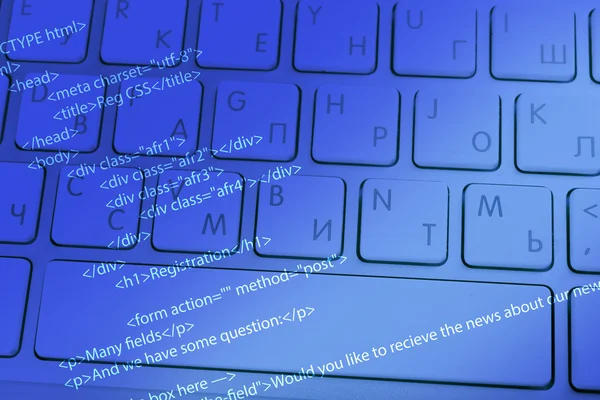 Computer keyboard with program code — Stock Photo, Image