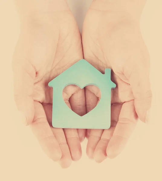 Female hands with model of house — Stock Photo, Image