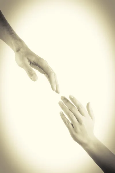 Hands reaching toward each other — Stock Photo, Image