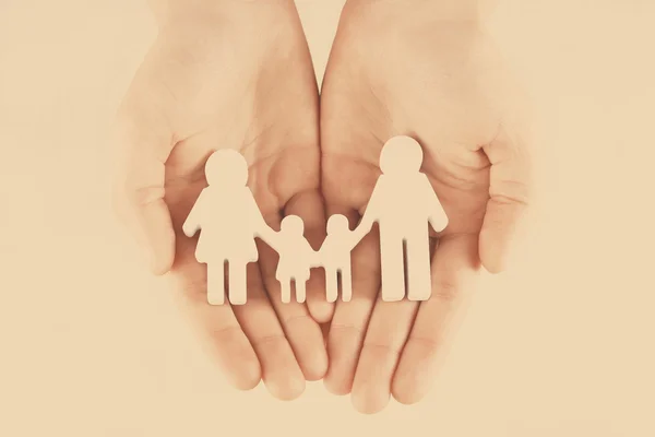 Female hands with family model — Stock Photo, Image