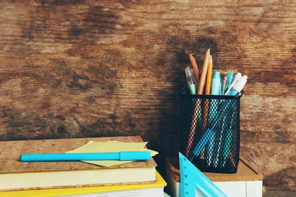 School supplies on old wooden table — Stock Photo, Image