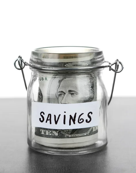 Jar for savings full of banknotes — Stock Photo, Image