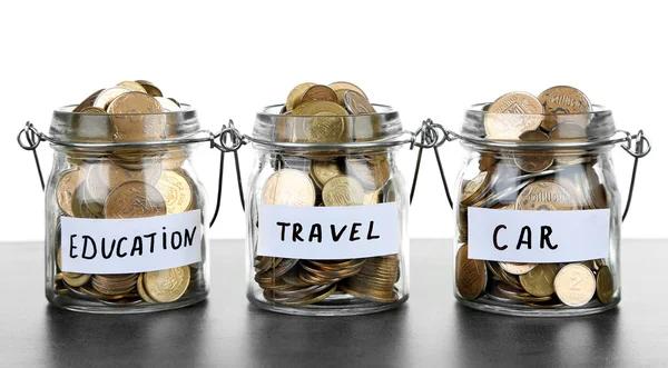 Jars for needs full of coins — Stock Photo, Image