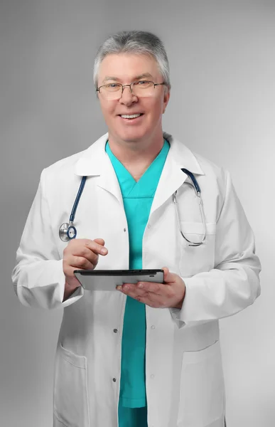 Doctor with stethoscope on background — Stock Photo, Image