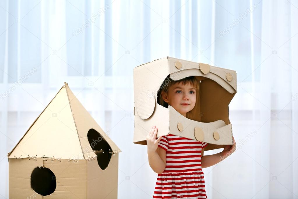 depositphotos_99089324-stock-photo-girl-playing-with-cardboard-space.jpg
