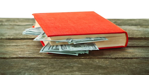 Red book with nested dollar banknotes — Stock Photo, Image
