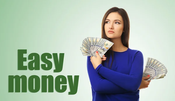 Frau im Besitz von Geld — Stockfoto