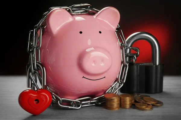 Piggy bank and chains — Stock Photo, Image