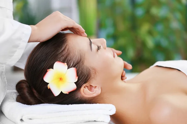 Woman relaxing with face massage — Stock Photo, Image