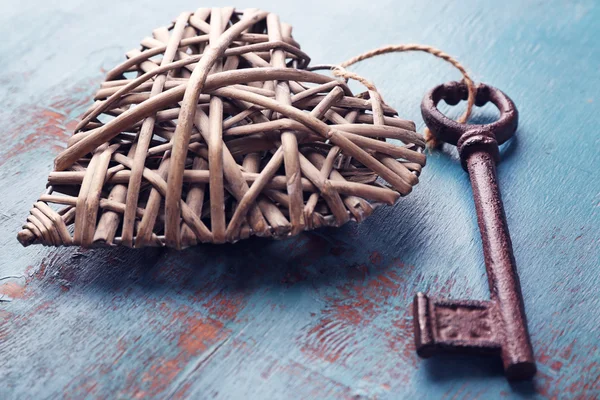 Old key with decorative heart — Stock Photo, Image