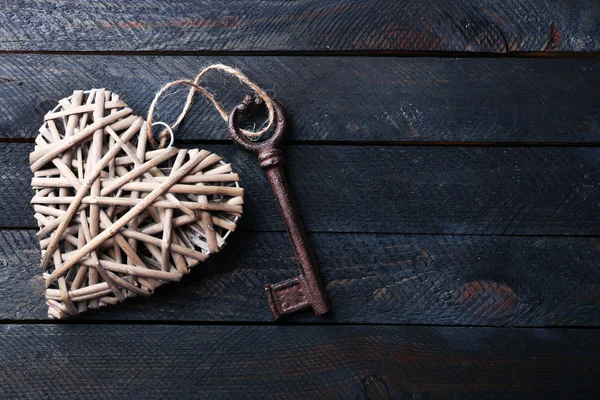 Old key with decorative heart — Stock Photo, Image