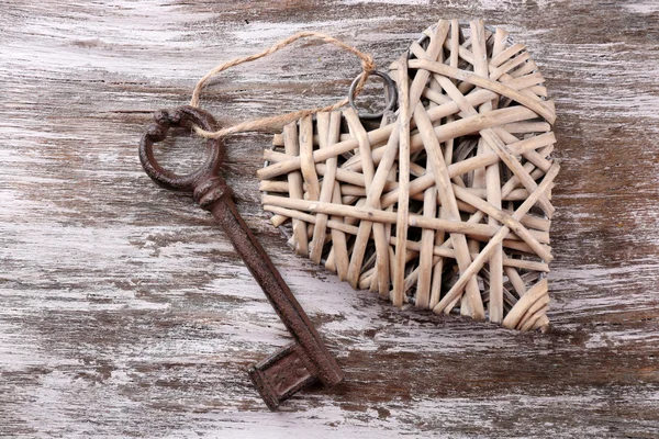 Old key with decorative heart — Stock Photo, Image