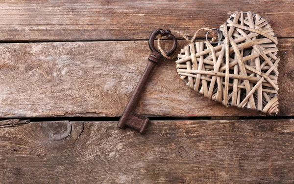 Old key with decorative heart — Stock Photo, Image