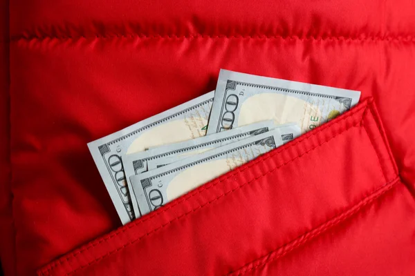 Cash in the red jacket pocket — Stock Photo, Image