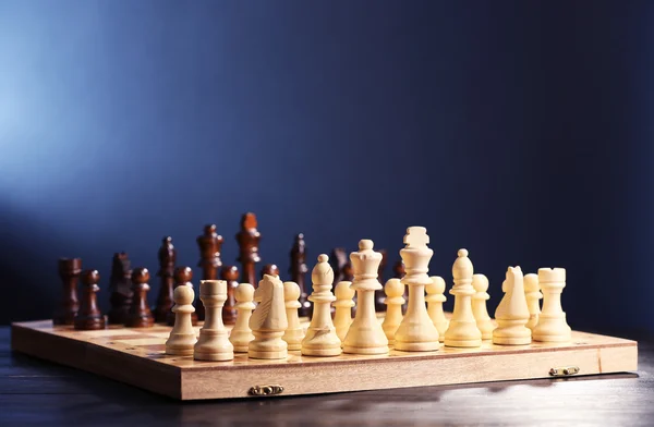 Chess pieces and game board — Stock Photo, Image