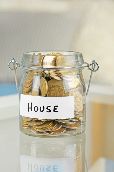 Glass jars with Ukrainian coins — Stock Photo, Image