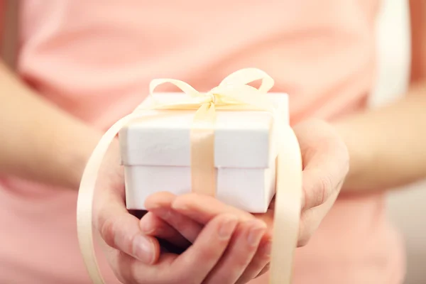 Hands holding beautiful small gift — Stock Photo, Image