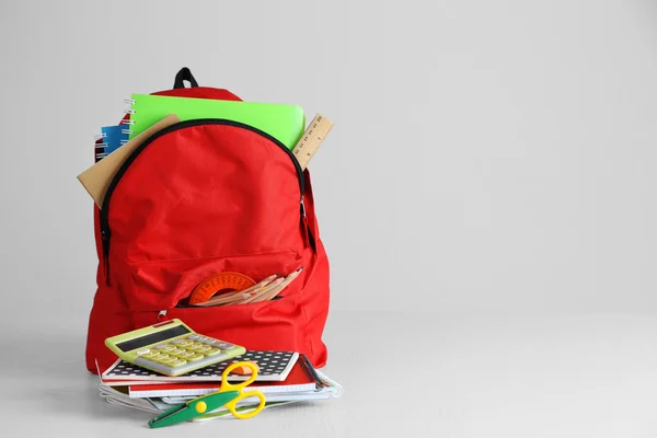 Backpack with school supplies — Stock Photo, Image