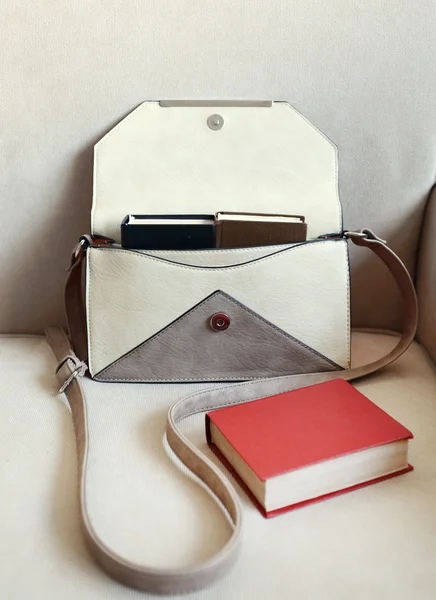 Female handbag with books — Stock Photo, Image