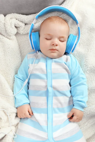 Cute baby sleeping with headphones — Stock Photo, Image