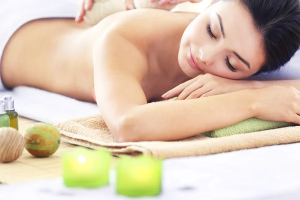Relaxing massage with herbal balls — Stock Photo, Image