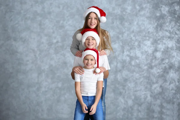 Boys and girl in Santa hats — Stock Photo, Image