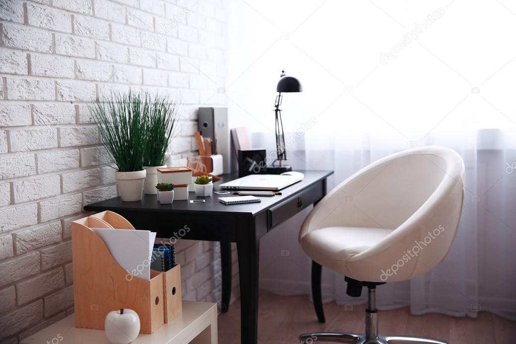 Workplace with laptop on table 