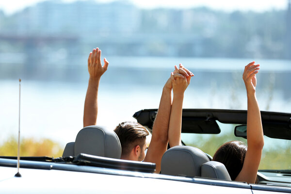 Couple in cabriolet car