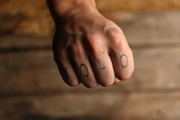 Tattoo inscriptions on male fingers — Stock Photo, Image