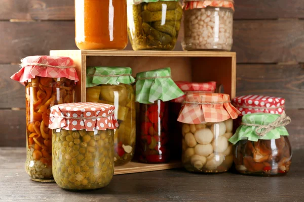 Jars with pickled vegetables and beans — Stock Photo, Image