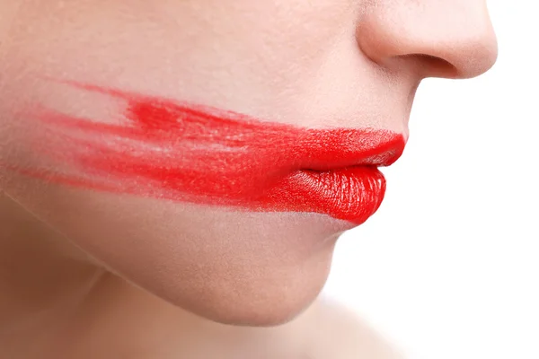 Woman's face with smeared  lipstick — Stock Photo, Image