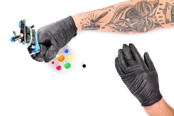 Tattooist hands in black gloves — Stock Photo, Image