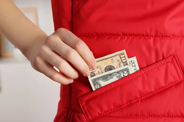 Cash in the red jacket pocket — Stock Photo, Image