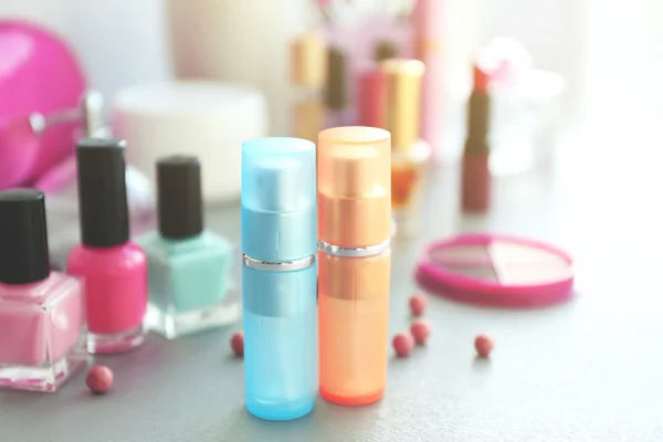 Perfume bottles with makeup cosmetics — Stock Photo, Image