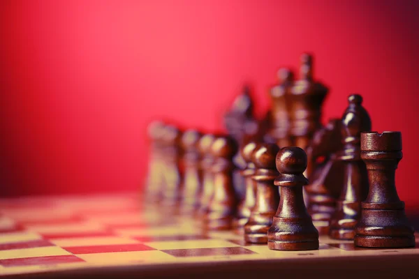 Chess pieces and game board — Stock Photo, Image