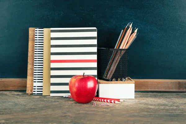 School supplies on old wooden table — Stock Photo, Image