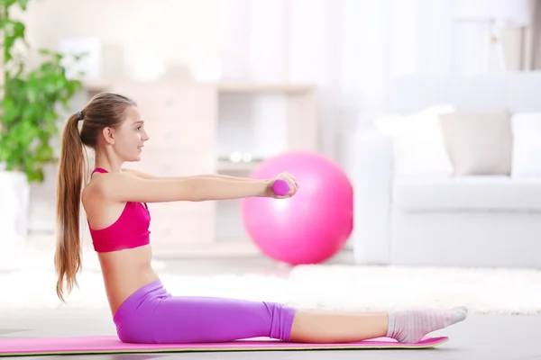 Young girl making fitness exercise — Stock Photo, Image