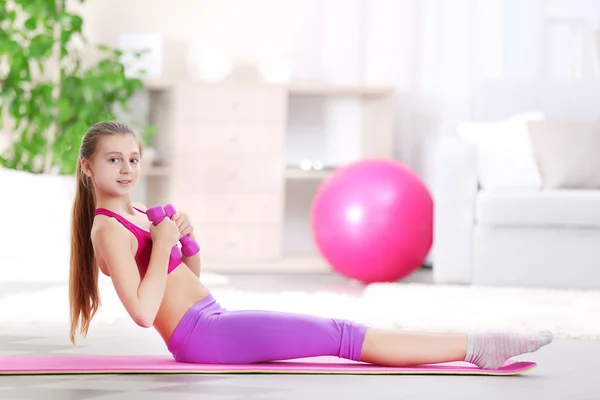 Young girl making fitness exercise — Stock Photo, Image