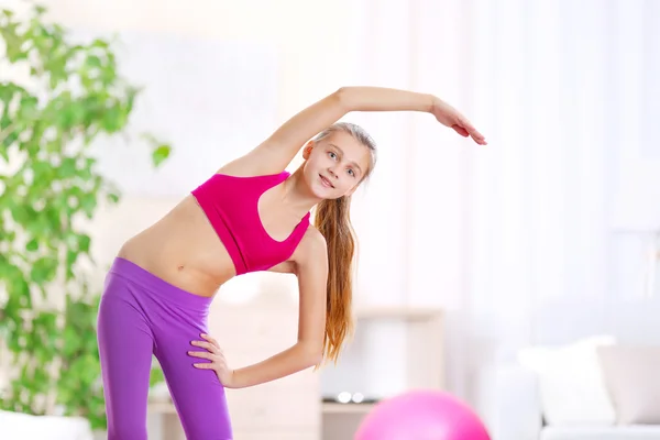 Young girl making fitness exercise — Stock Photo, Image