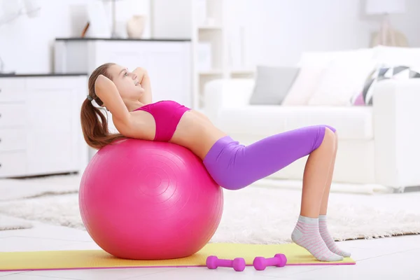 Young girl making fitness exercise — Stock Photo, Image