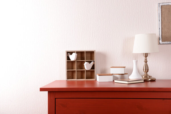 Room interior with red wooden commode  