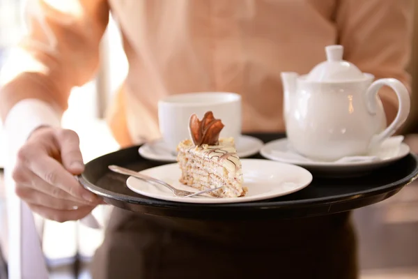 Waiter holding tray — Stock Photo, Image