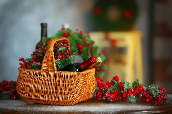 Christmas wine in basket on table — Stock Photo, Image