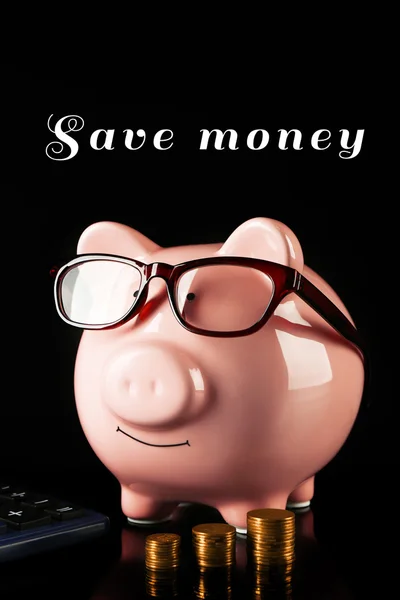 Piggy bank with glasses — Stock Photo, Image