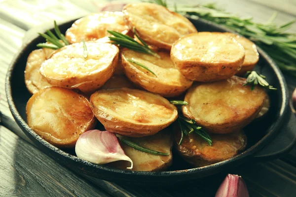Delicious baked potato with rosemary — Stock Photo, Image